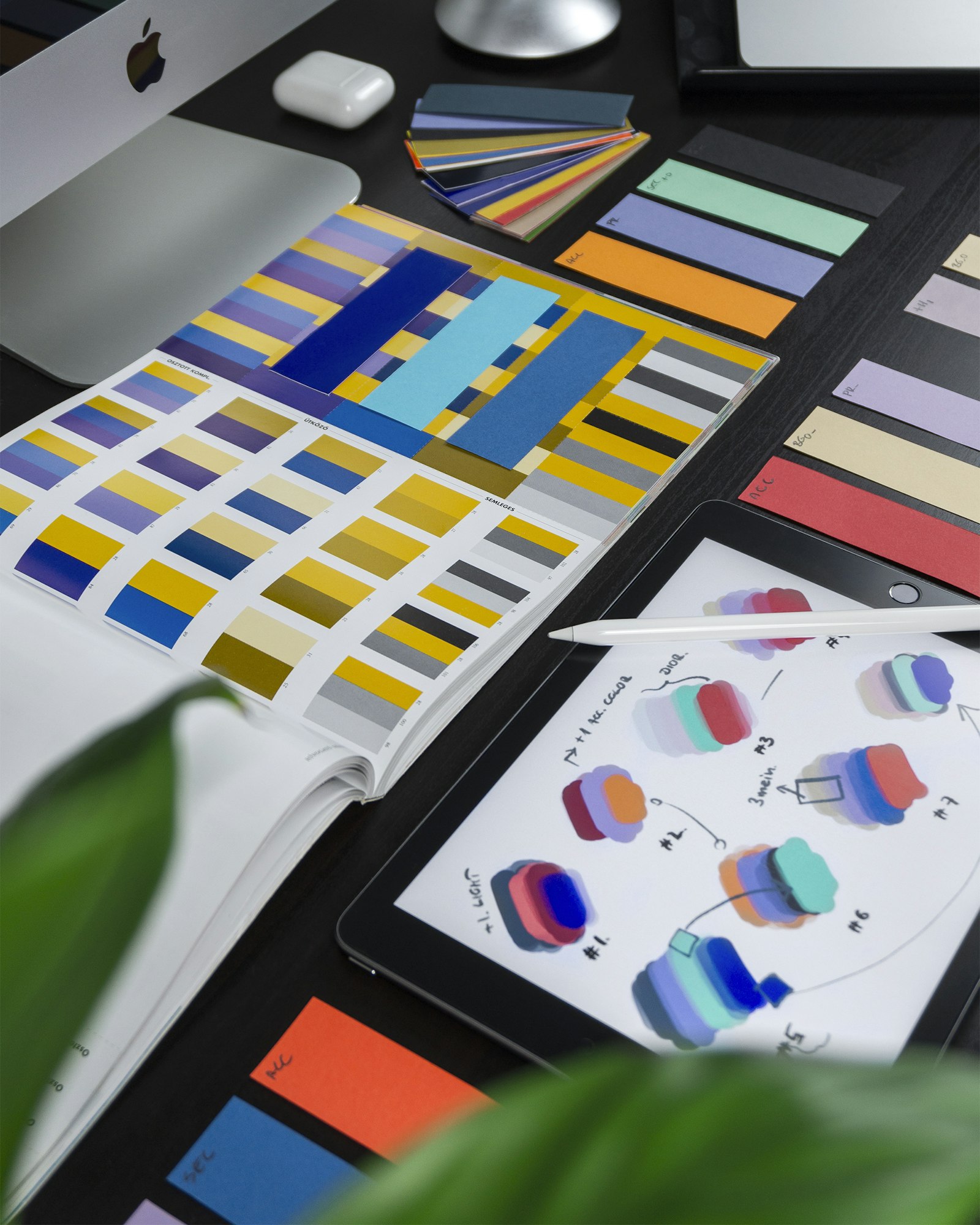 Design tools and color swatches on a desk